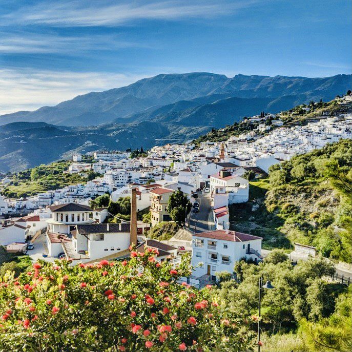 The photo is of Cómpeta, a white mountainside pueblo in Southern Spain in the Andalucia region
