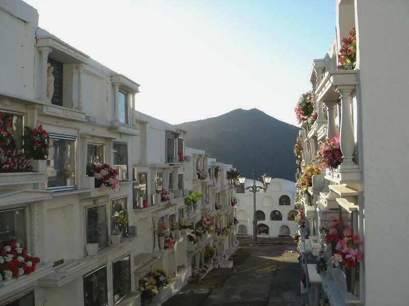 Image shows in details the tumbas or graves of the Cementerio Redondo in Sayalonga, Spain. The details lead historians to believe that the cemetery was constructed by the Freemasons.
