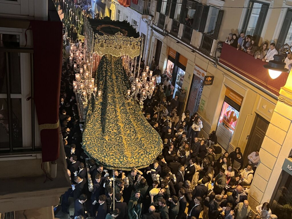 The image is from Semana Santa 2023 and shows the Easter procession of the Tronos of the Virgin Mary